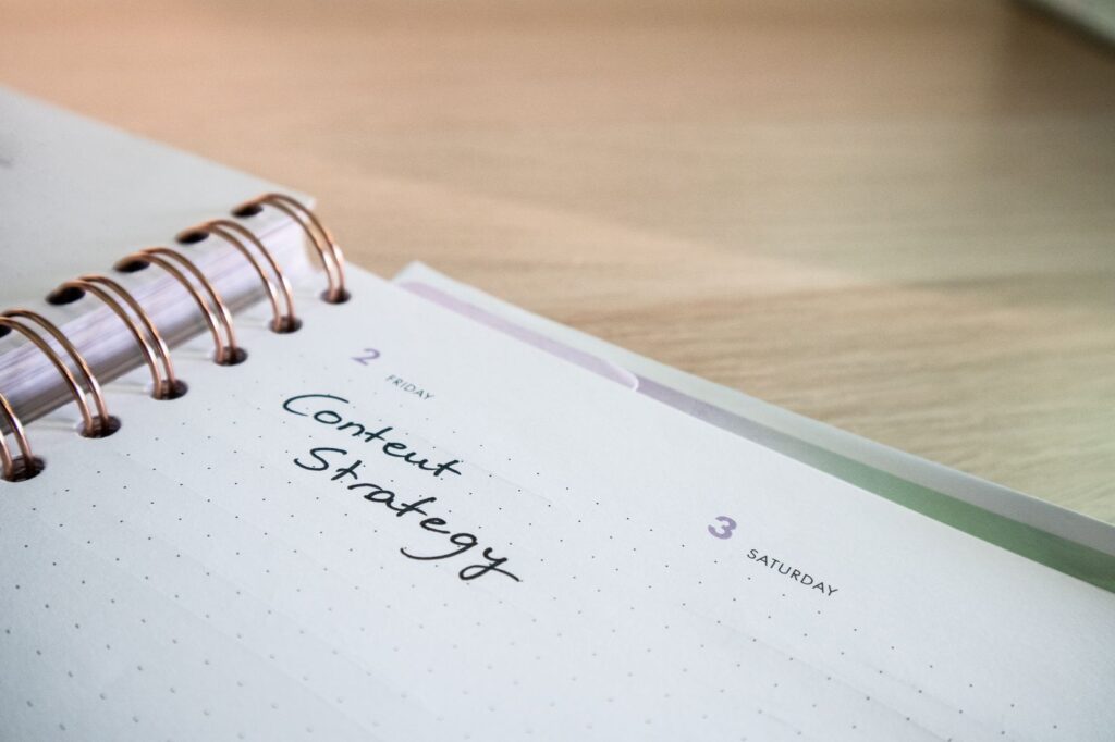 Planner page with Content Strategy handwritten on it, planning SEO content for a business website