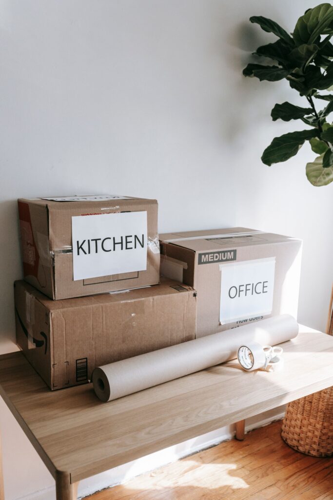 Labelled cardboard boxes packed for a move, a picture of planning a website migration carefully